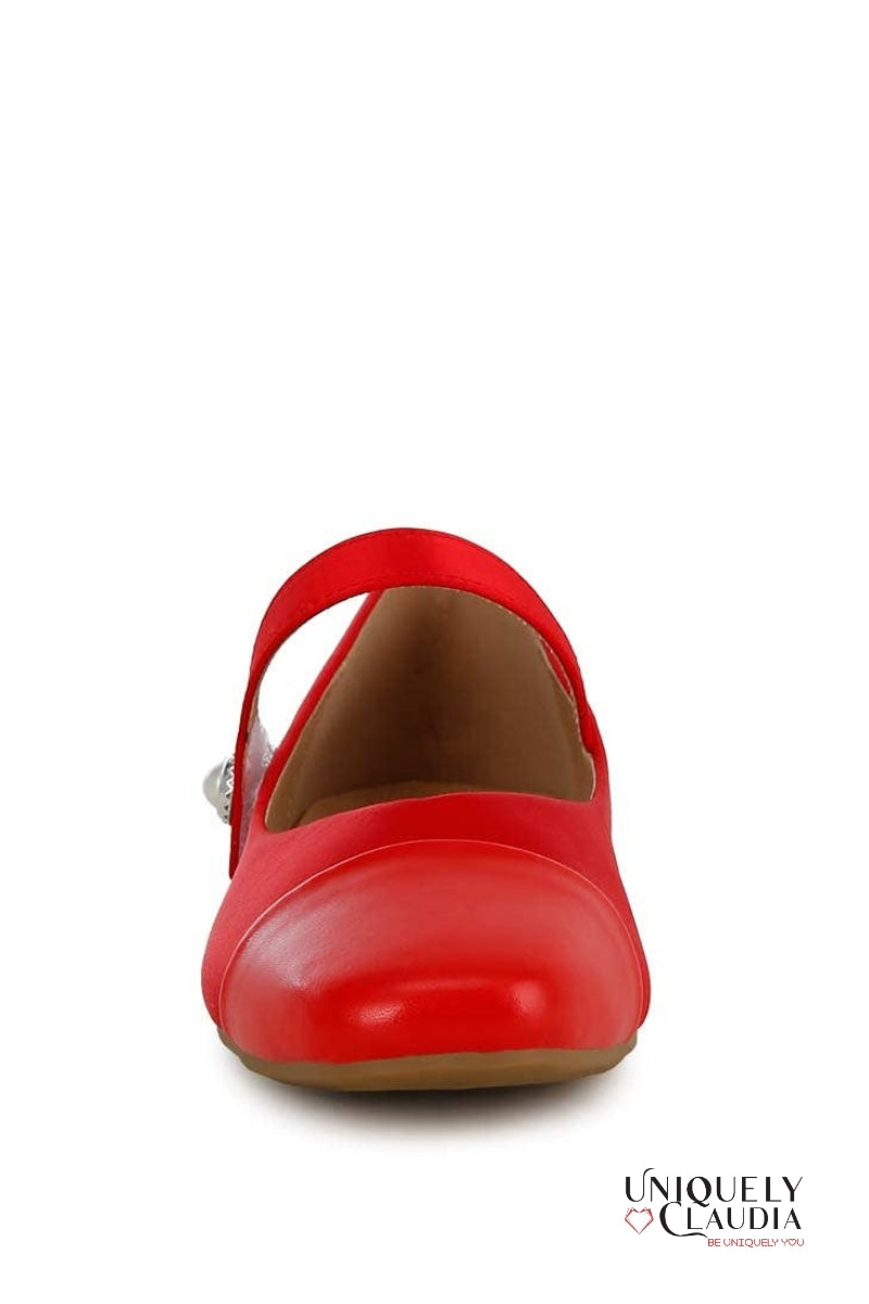 Red shoe with a strap on a white background,