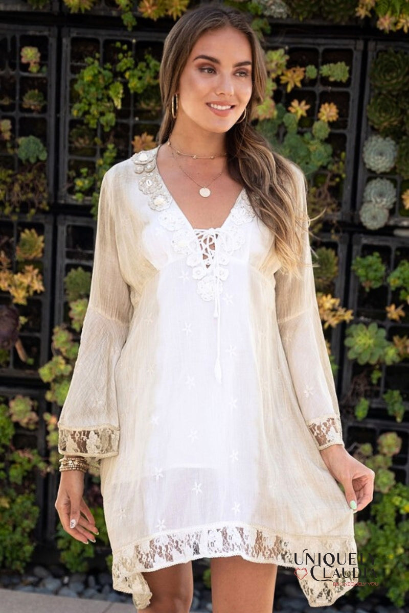 woman wearing summer dress accented with shells and lace