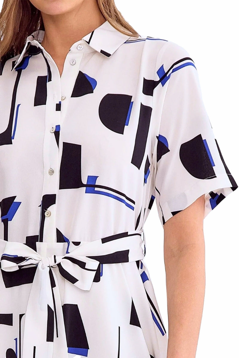 White shirt with black and blue abstract pattern worn by a person