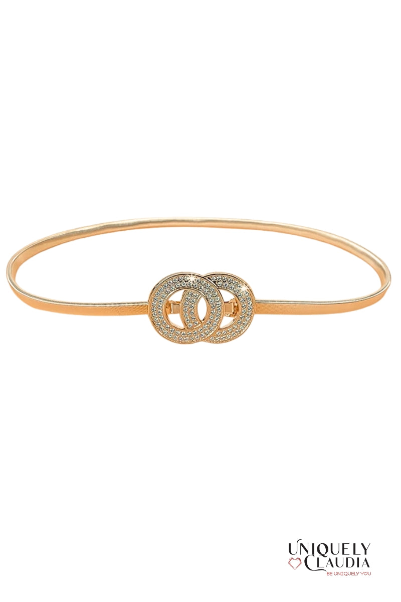 Gold belt with interlocking circular design on a white background