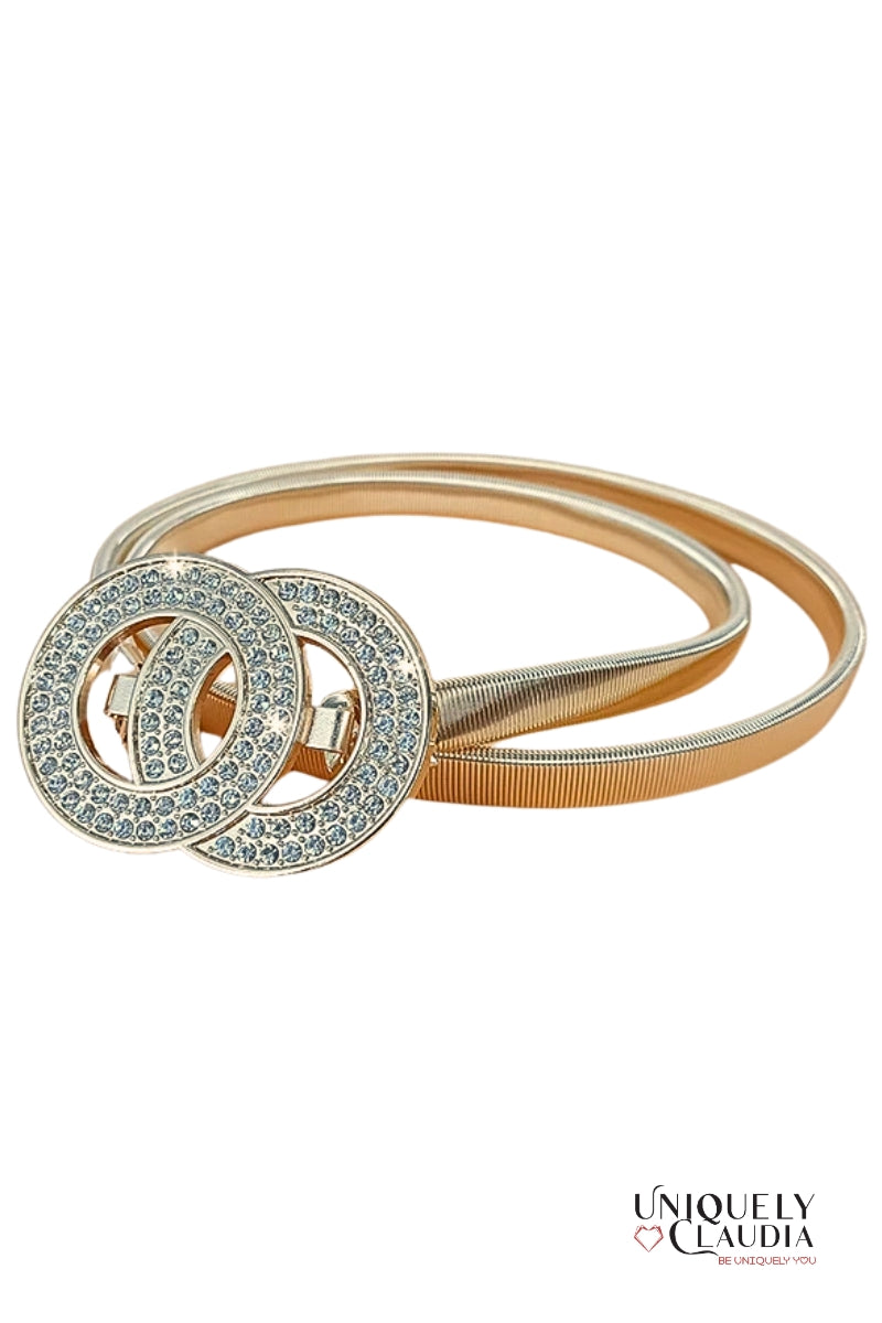 Gold belt with interlocking circular design on a white background