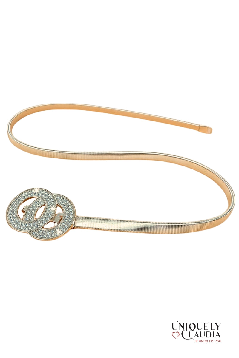 Gold belt with interlocking circular design on a white background