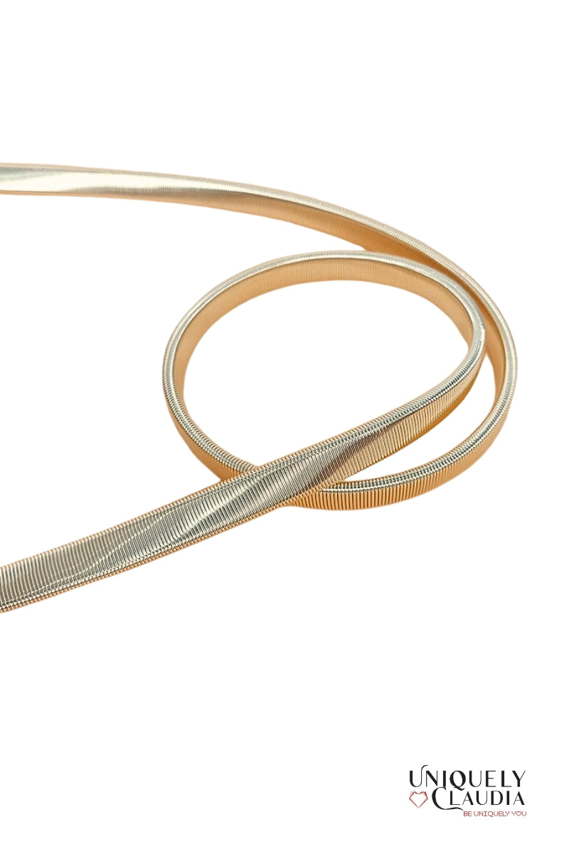 Gold belt with interlocking circular design on a white background