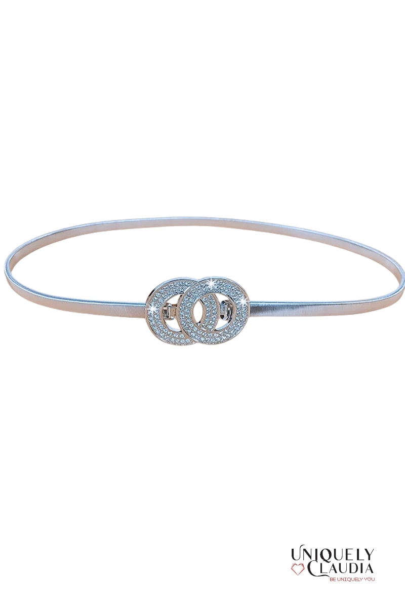 Silver belt with interlocking circular design on a white background