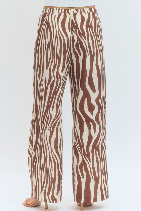 Zebra patterned pants on a white background
