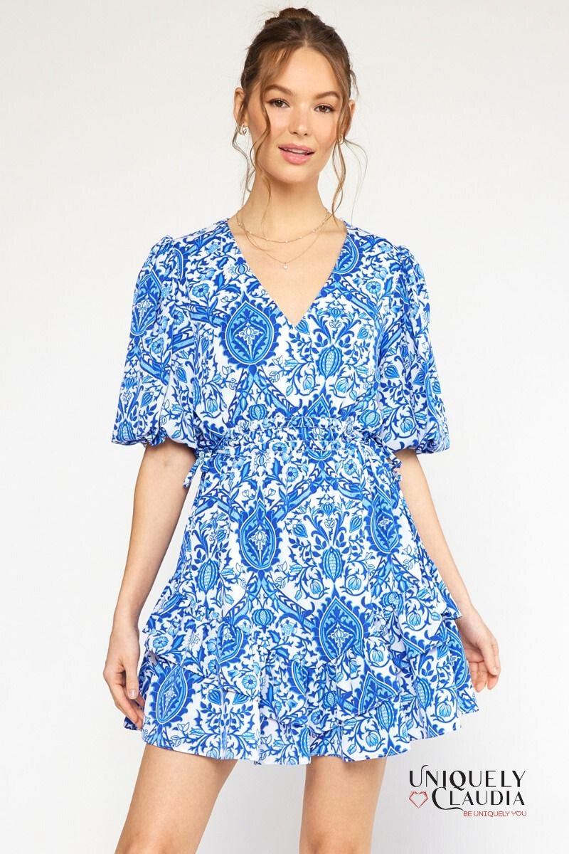 woman wearing blue puff sleeve dress