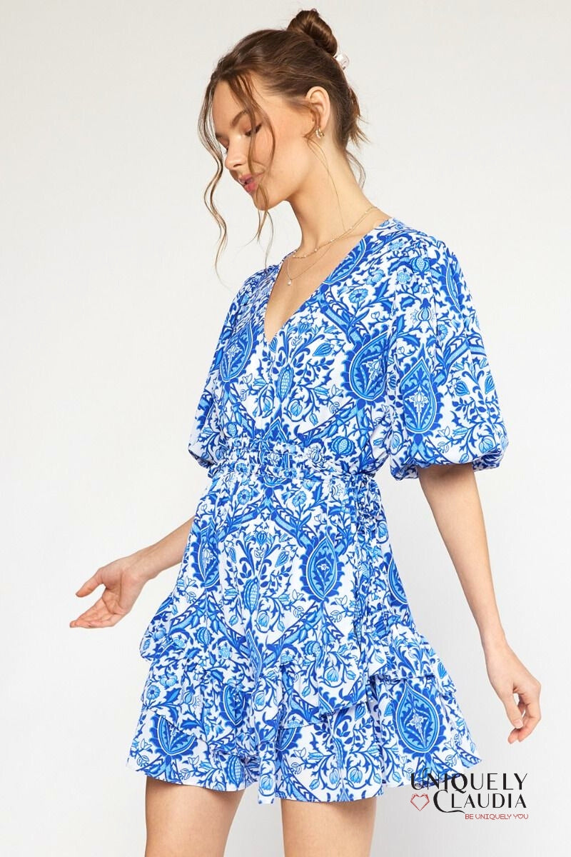 woman wearing blue puff sleeve dress