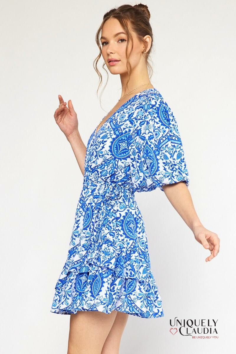 woman wearing blue puff sleeve dress
