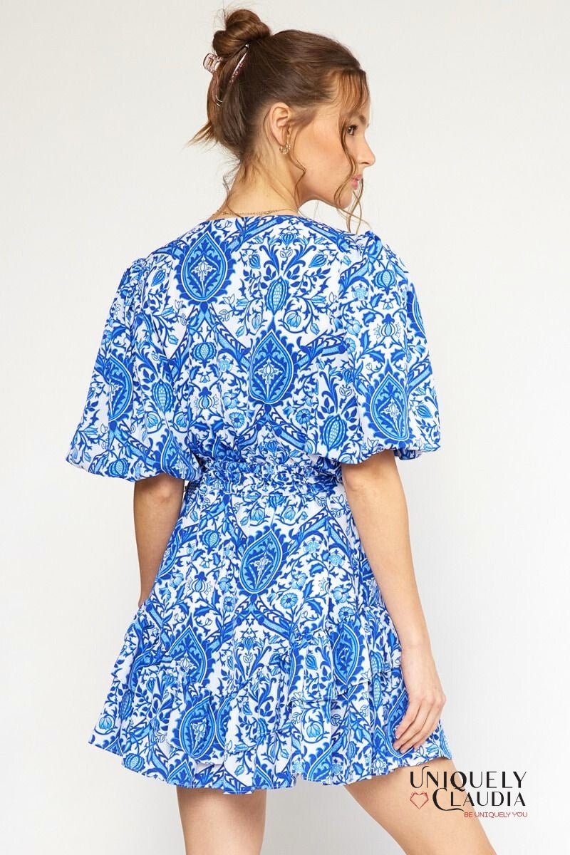 woman wearing blue puff sleeve dress