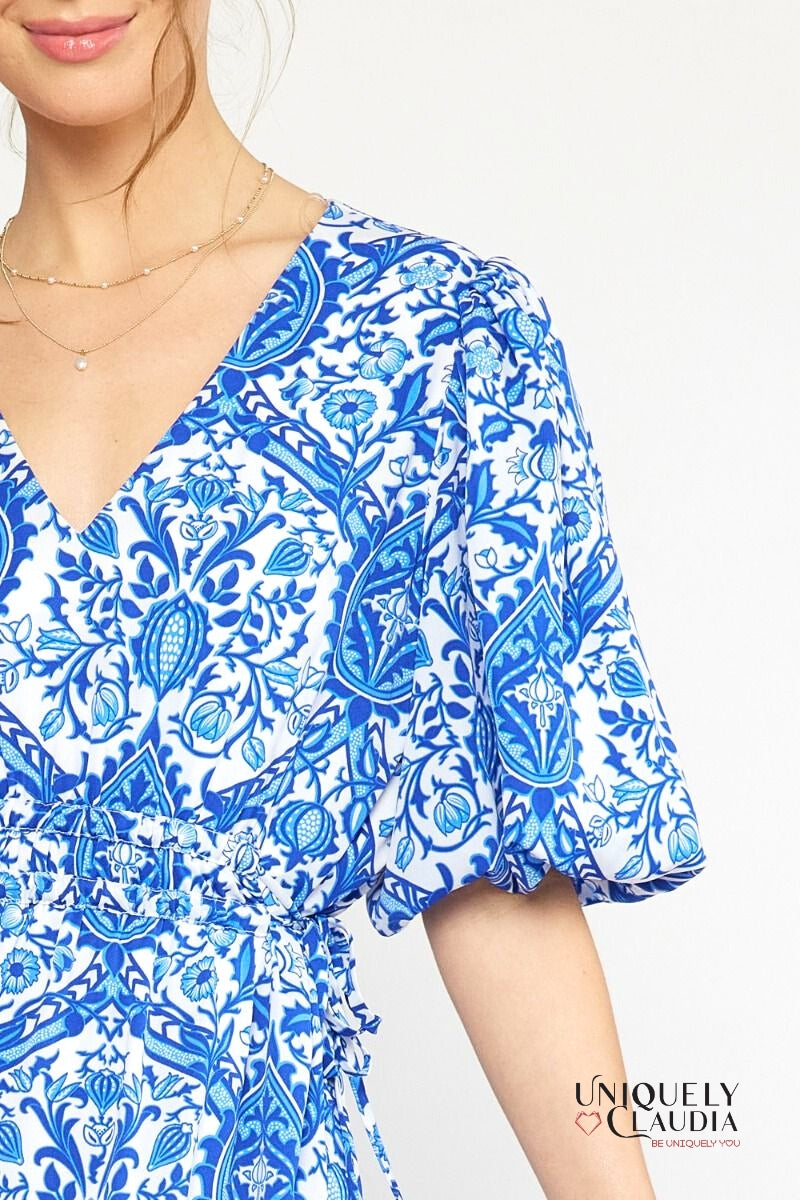 woman wearing blue puff sleeve dress