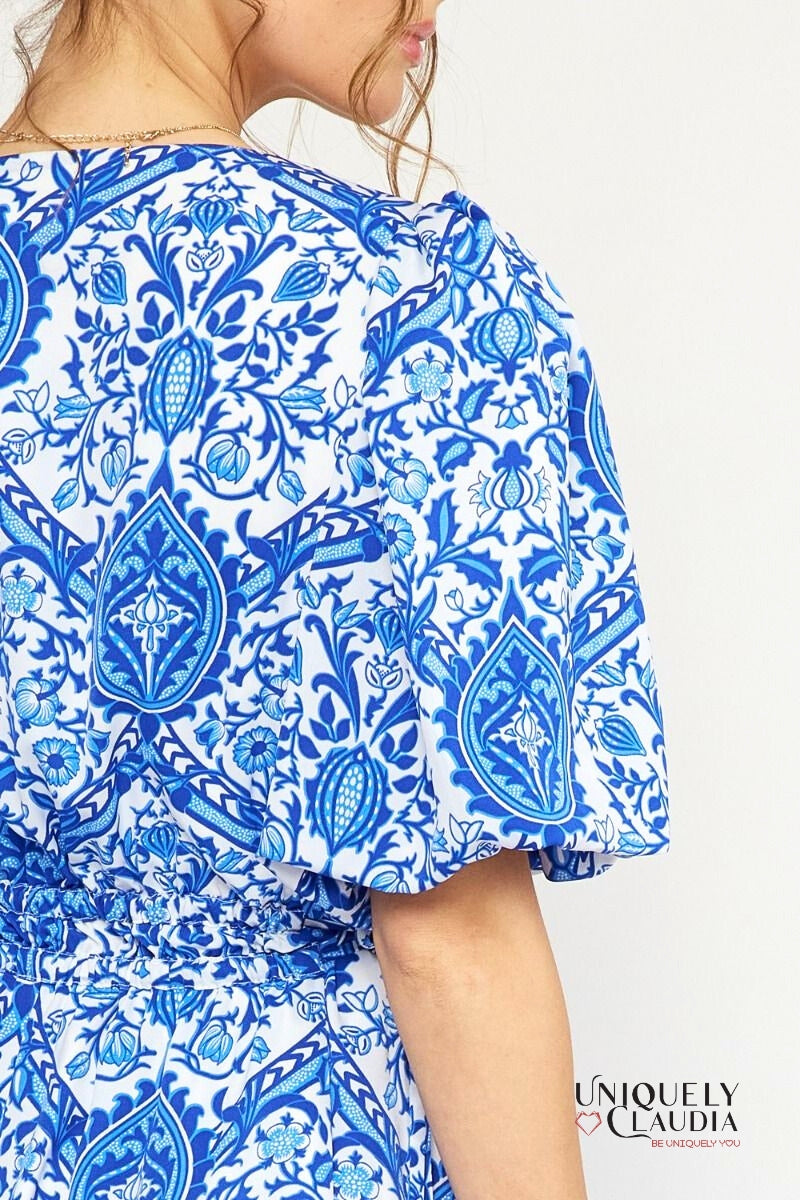 woman wearing blue puff sleeve dress