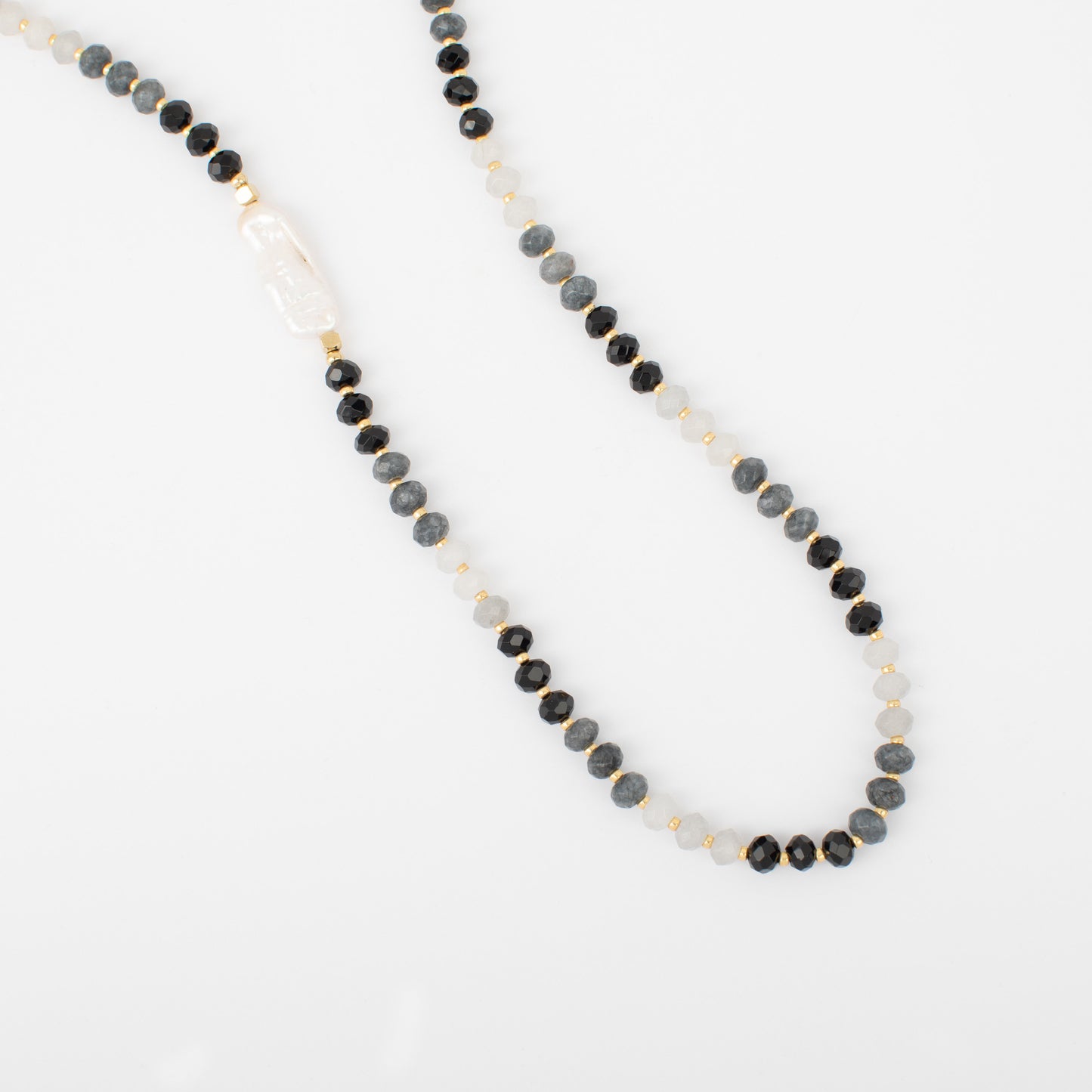 Necklace with black and gray beads on a white background