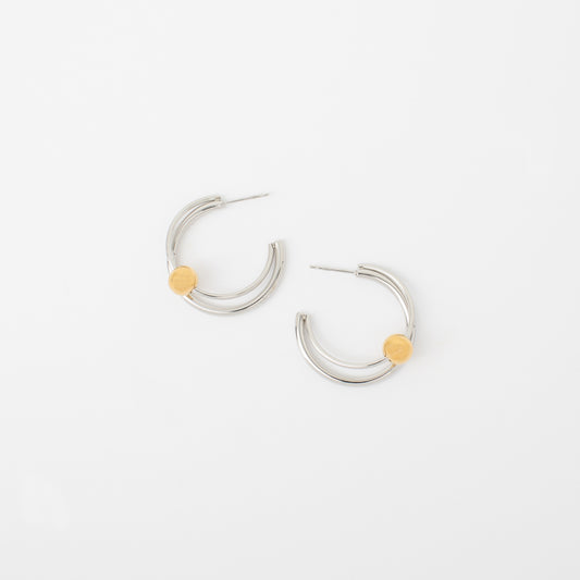 Silver hoop earrings with yellow accents on a white background
