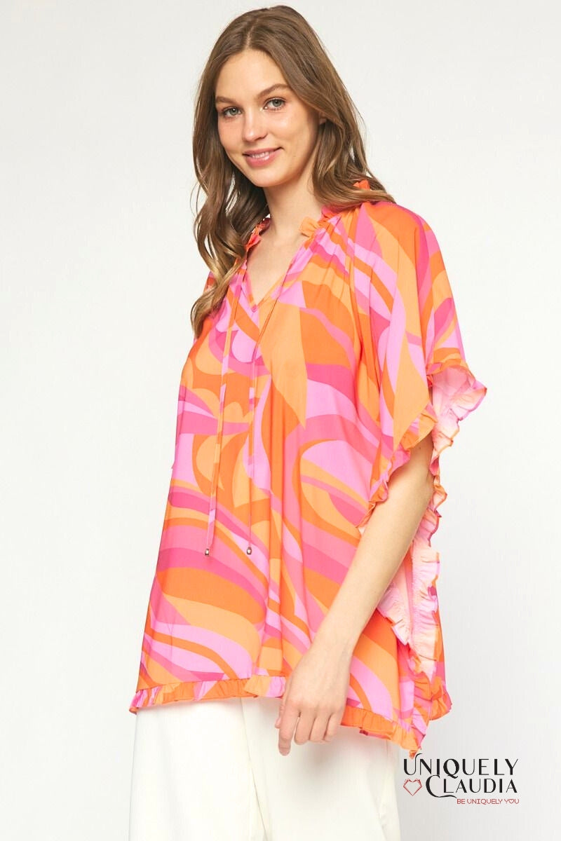 Woman wearing ruffle sleeve tunic