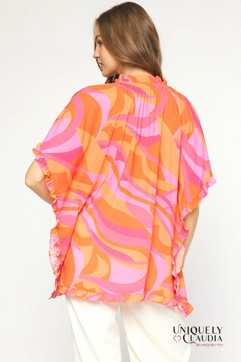 Woman wearing ruffle hem tunic