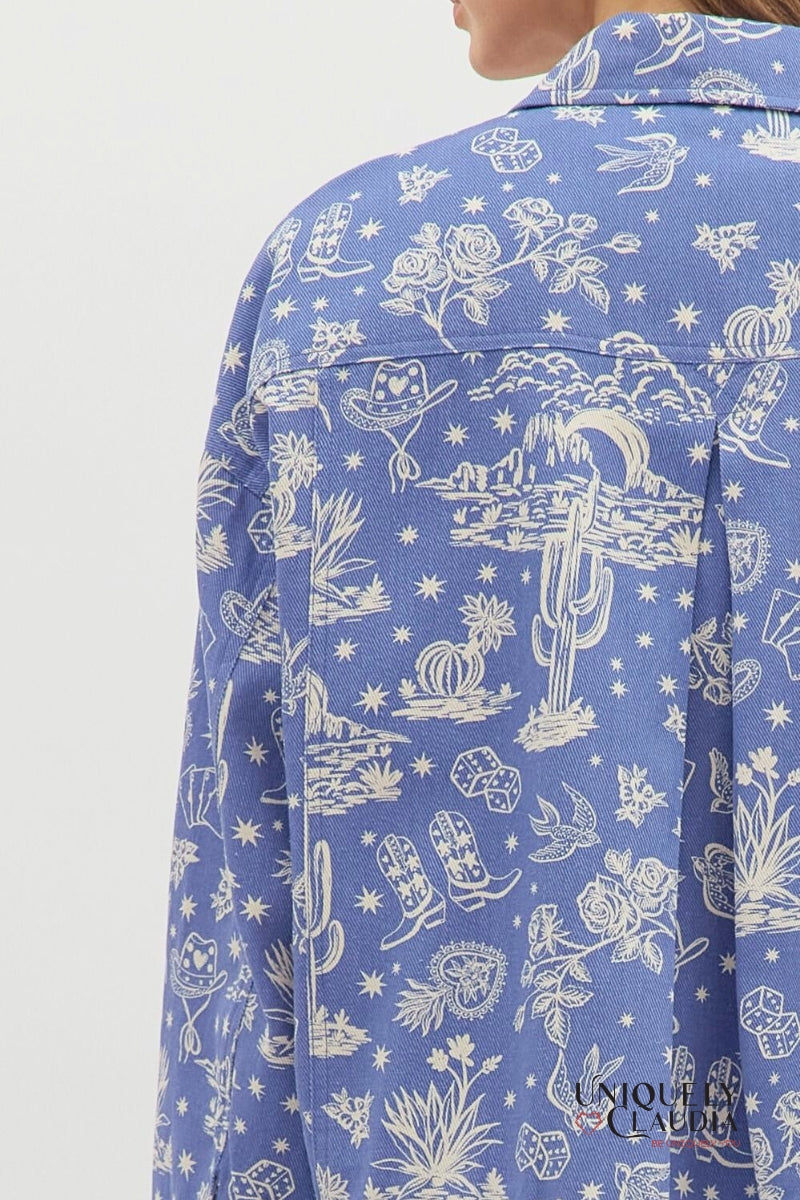 Blue shirt with white pattern on a plain background