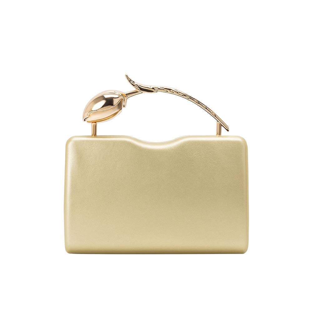 Gold clutch bag with a decorative handle on a white background