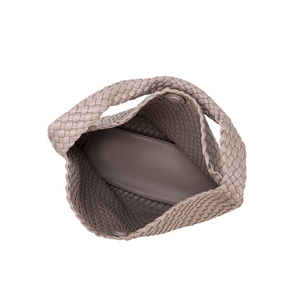 Woven pet carrier with a plain background