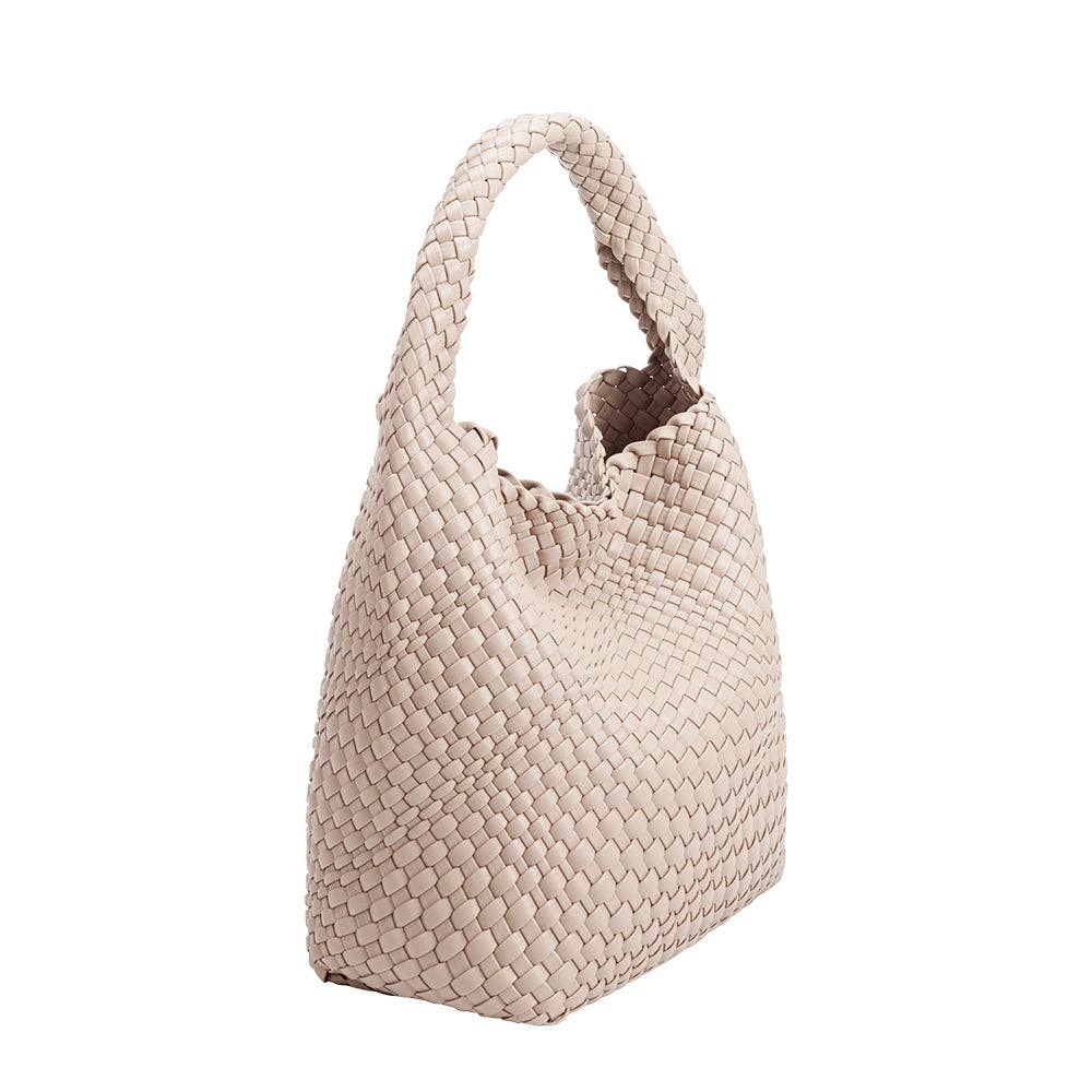 Beige woven handbag on a white background