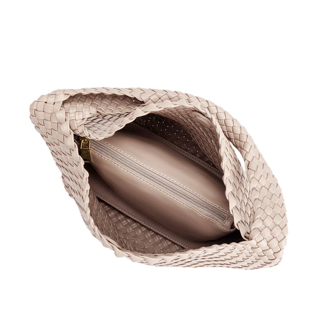 Woven handbag with a plain background