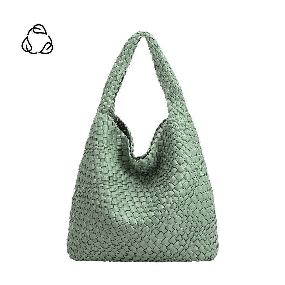 Mint green woven handbag on a white background