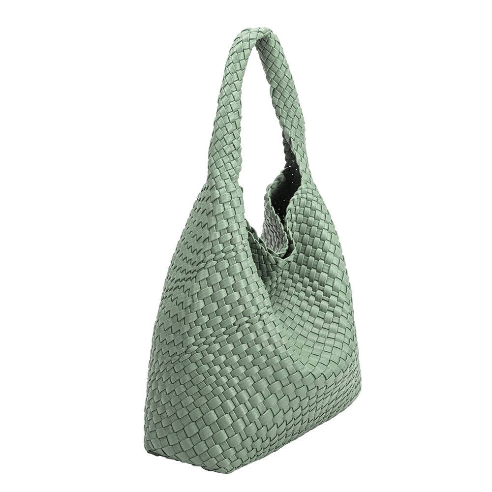 Green woven handbag on a white background