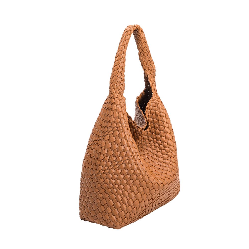 Saddle woven handbag on a white background