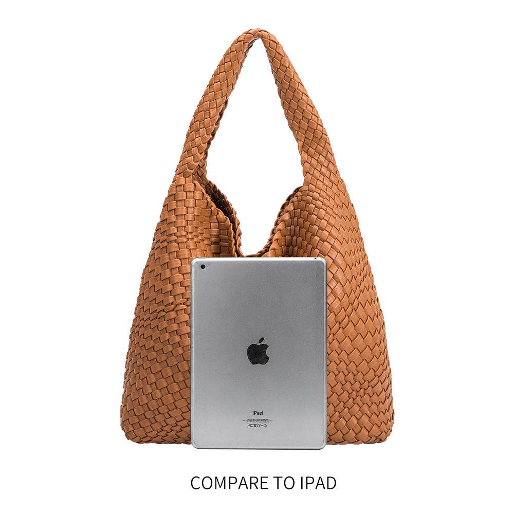 Saddle woven handbag with an iPad inside, on a white background