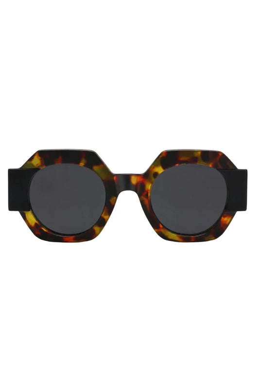 Hexagonal sunglasses with a glossy tortoiseshell acetate frame and dark gray round lenses, shown against a plain white background.