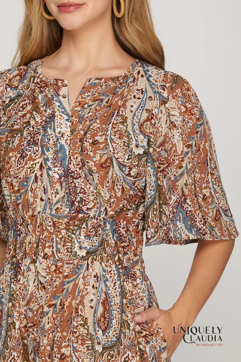 Patterned blouse worn by a person with 'Uniquely Claudia' branding.