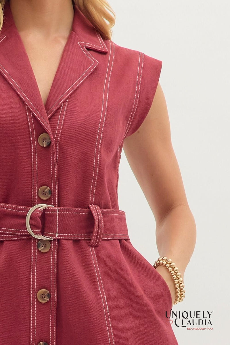 Red dress with buttons and a belt on a white background, featuring the brand 'Uniquely Claudia'.