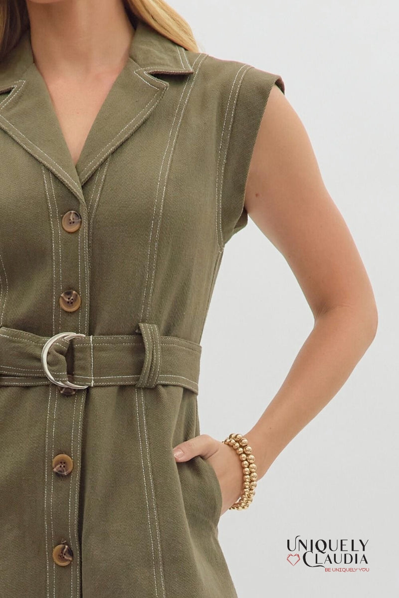 Green dress with buttons and a belt worn by a person on a light gray background, with 'Uniquely Claudia' branding.