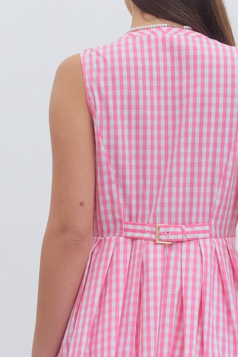 Pink and white checkered dress with a belt on a plain background