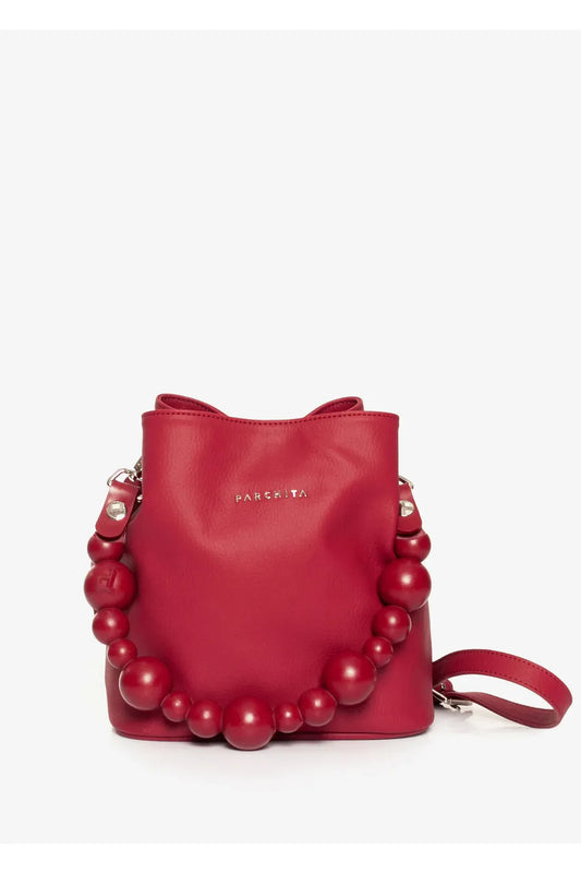 Red handbag with bead embellishments on a light gray background