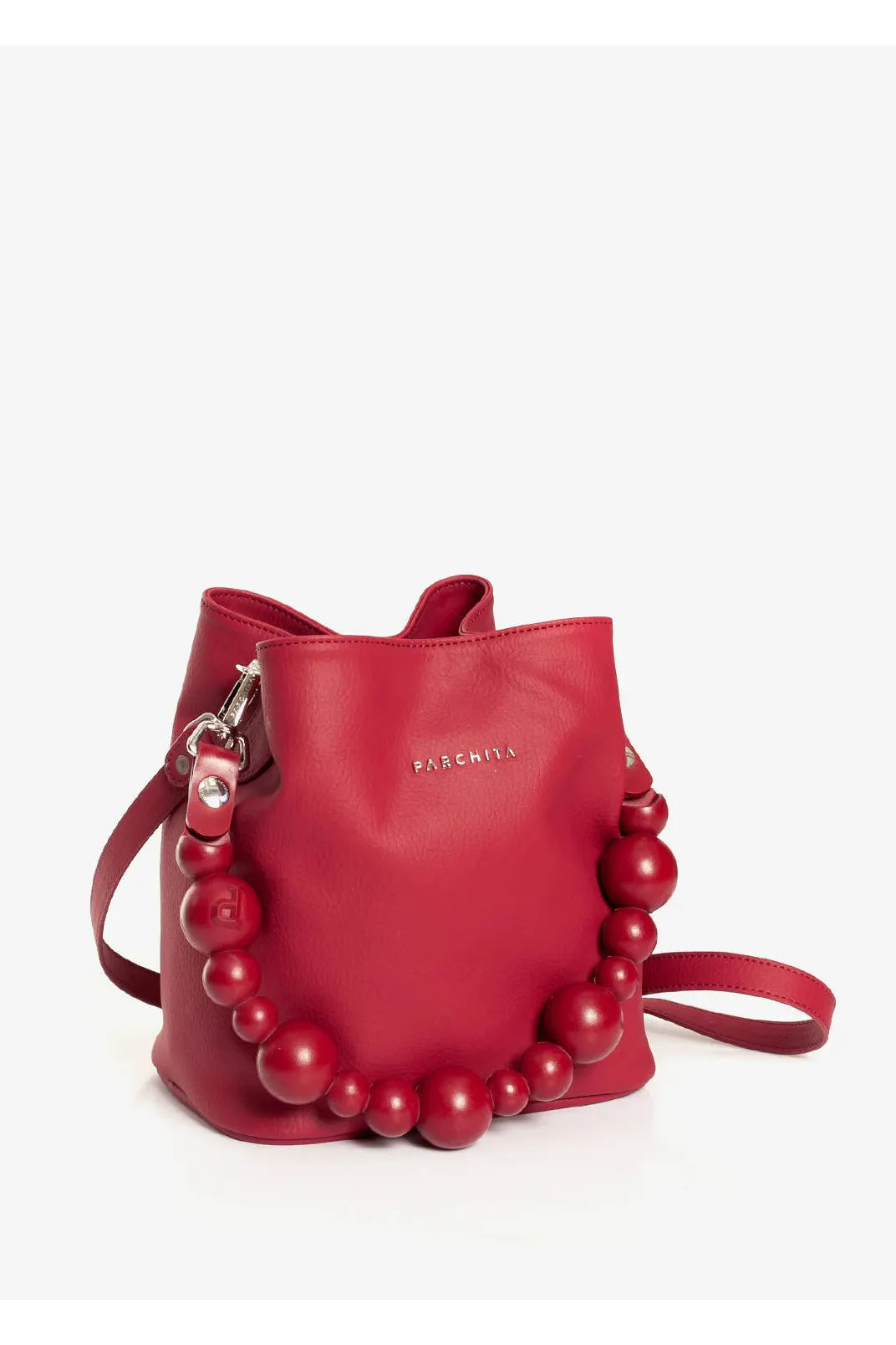 Red handbag with pearl embellishments on a white background