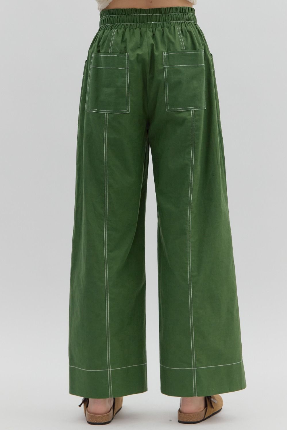 Green wide-leg pants on a white background