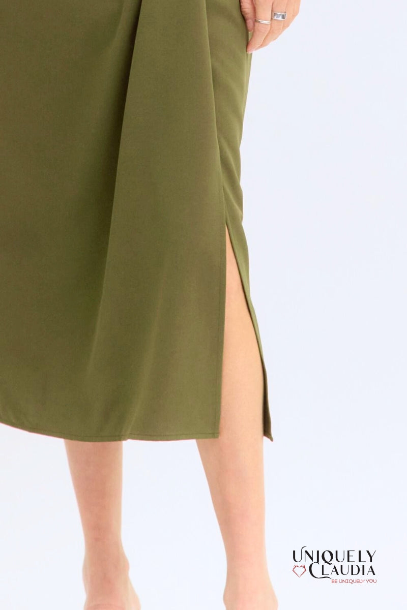 Green dress with a slit on a white background,