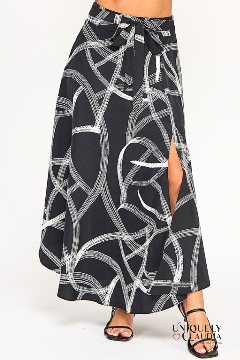 Black and white patterned skirt with a slit on a white background