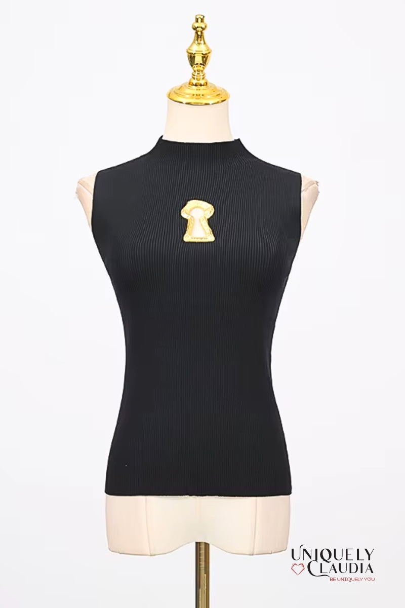 Black sleeveless top with a gold keyhole design on a mannequin against a white background.