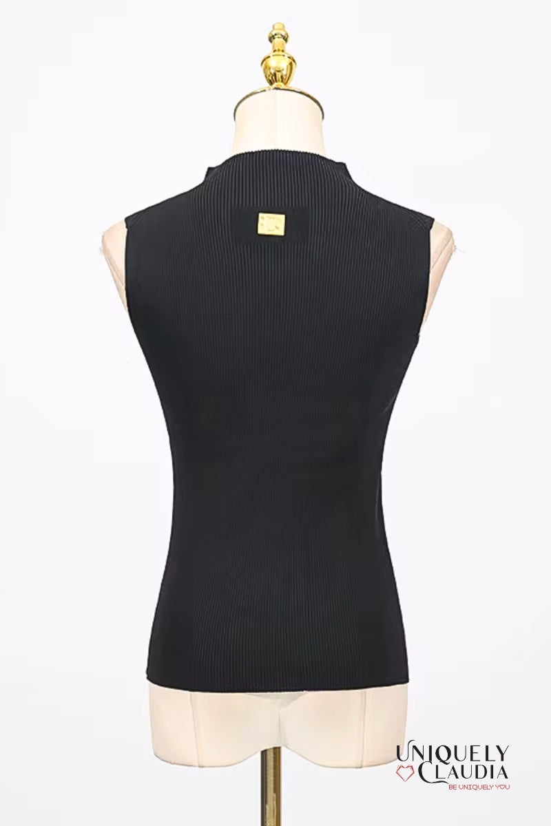 Black sleeveless top on a mannequin with 'Uniquely Claudia' branding.