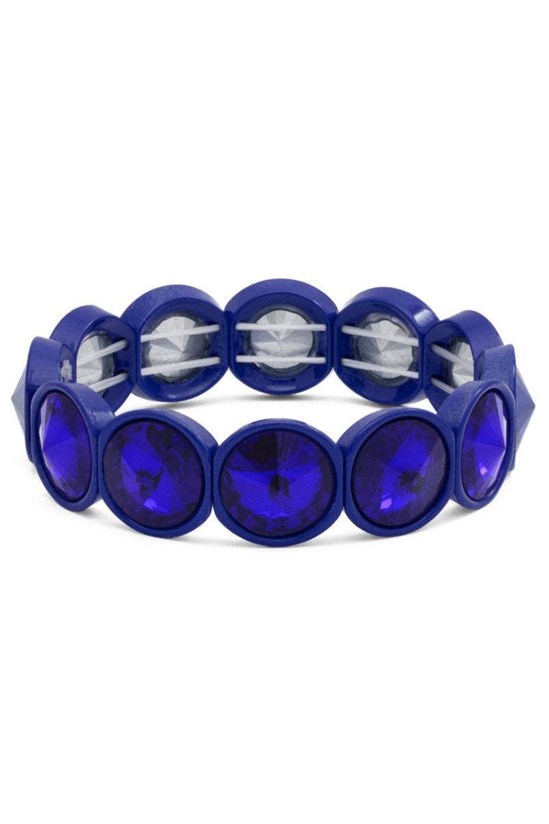 Blue bracelet with circular beads on a white background
