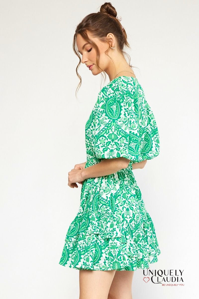 woman wearing green puff sleeve dress