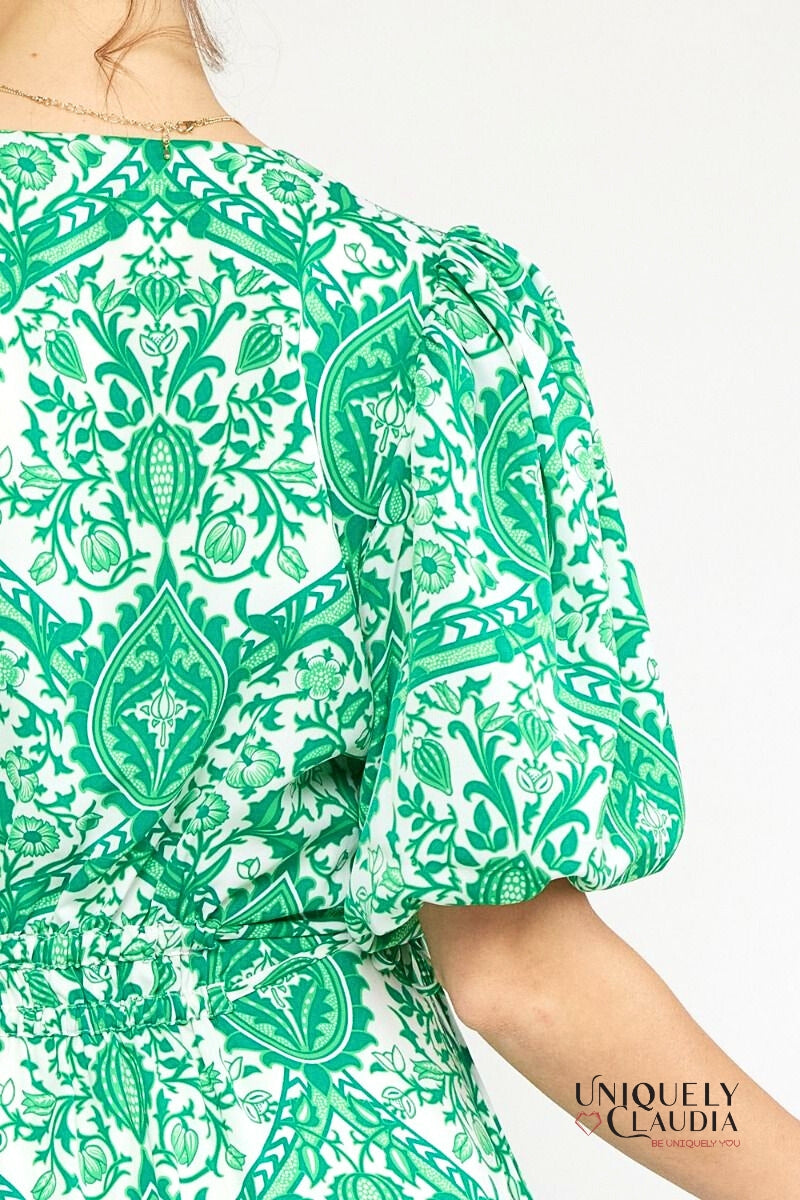 woman wearing green puff sleeve dress