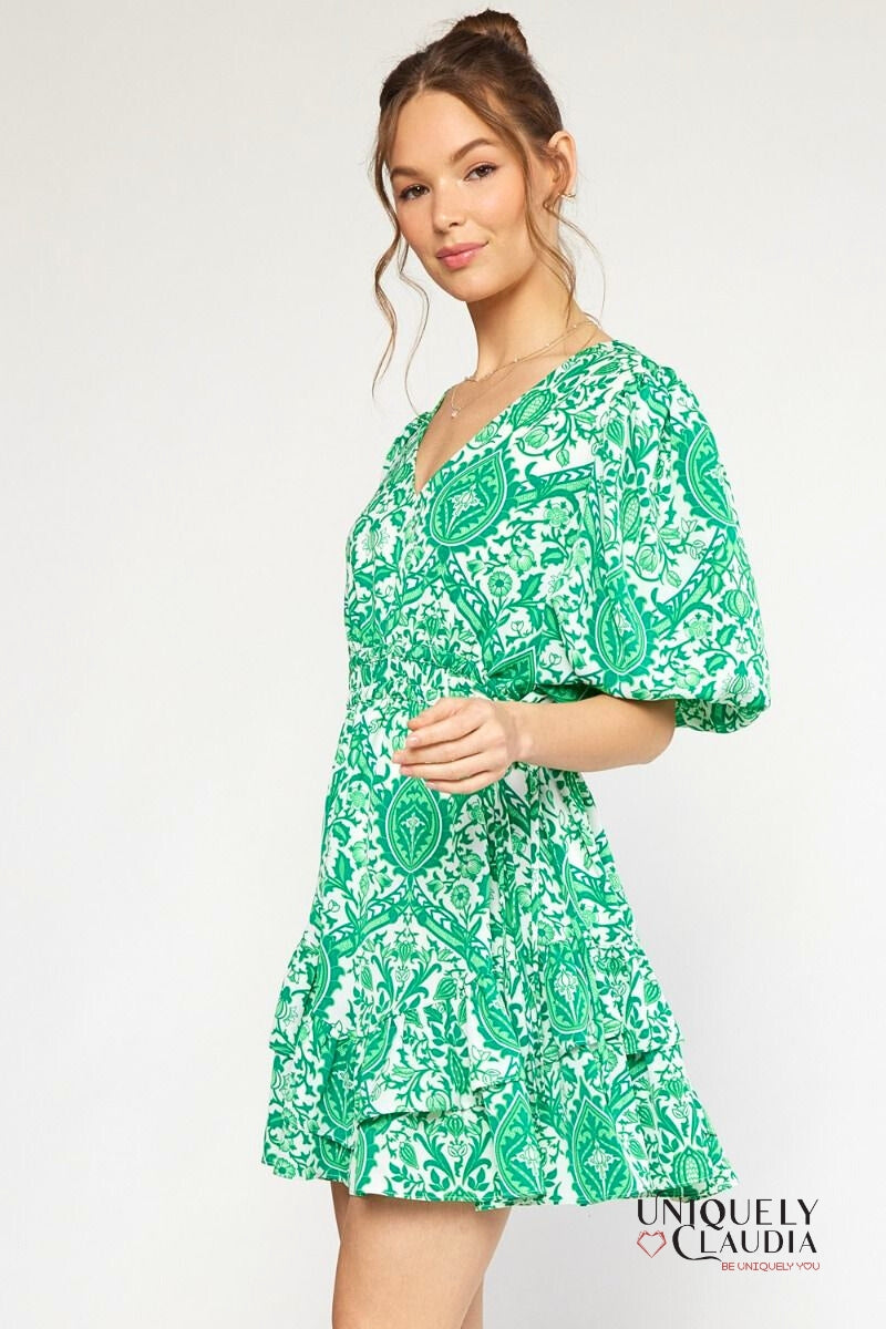 woman wearing green puff sleeve dress