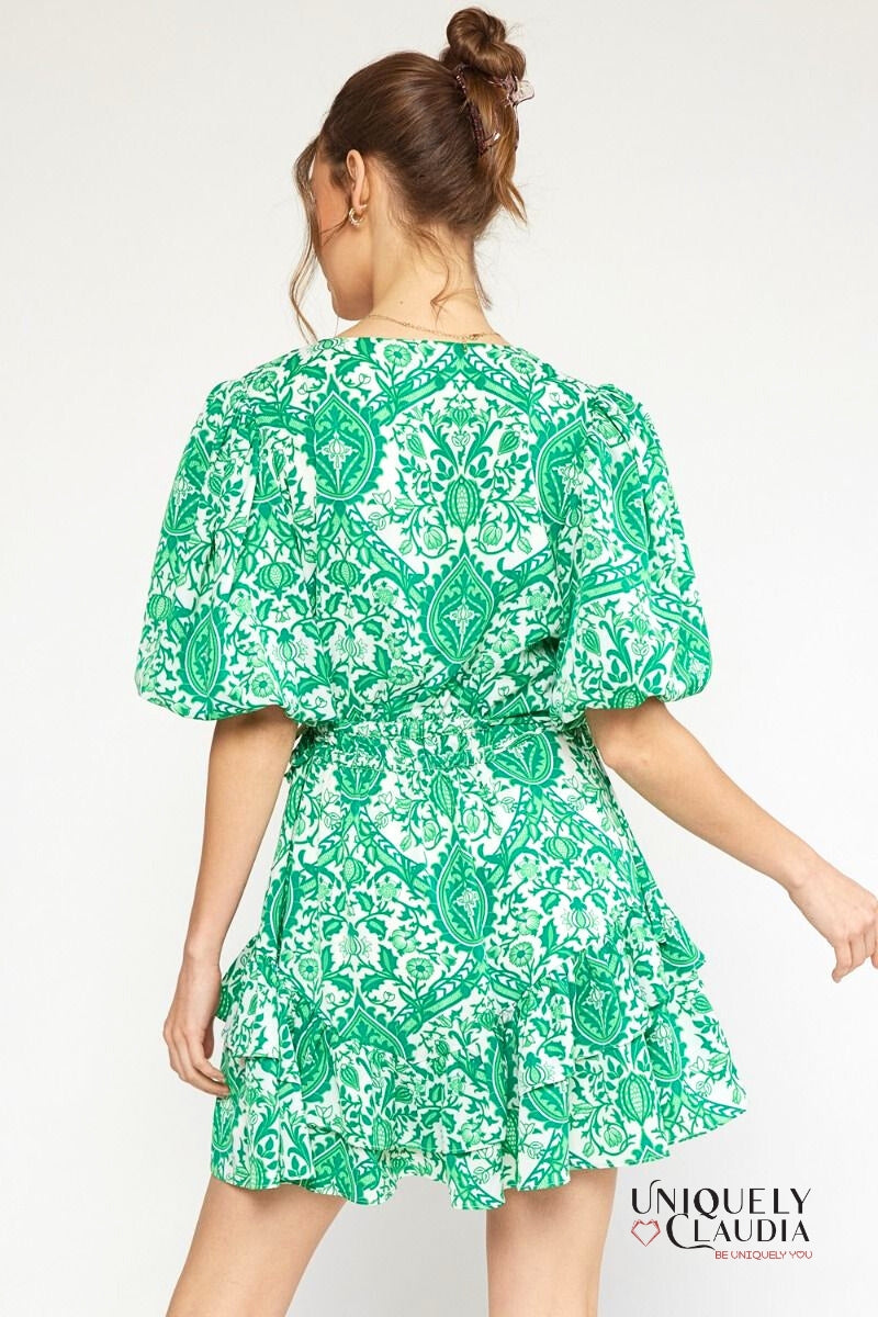woman wearing green puff sleeve dress
