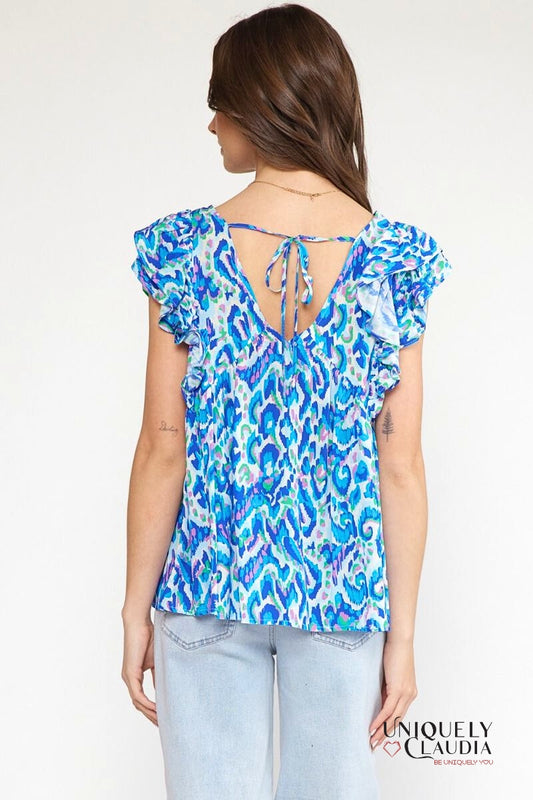 Woman wearing ruffle top