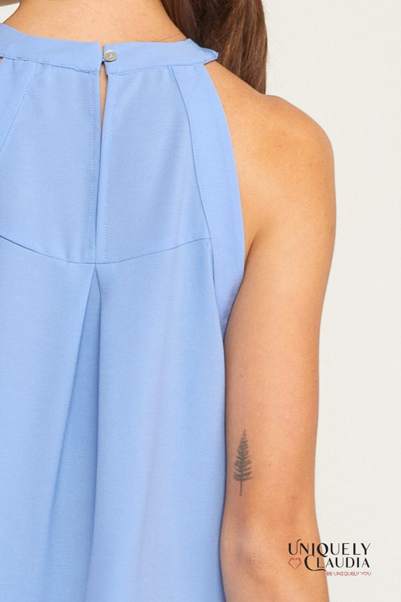 Woman wearing blue halter top