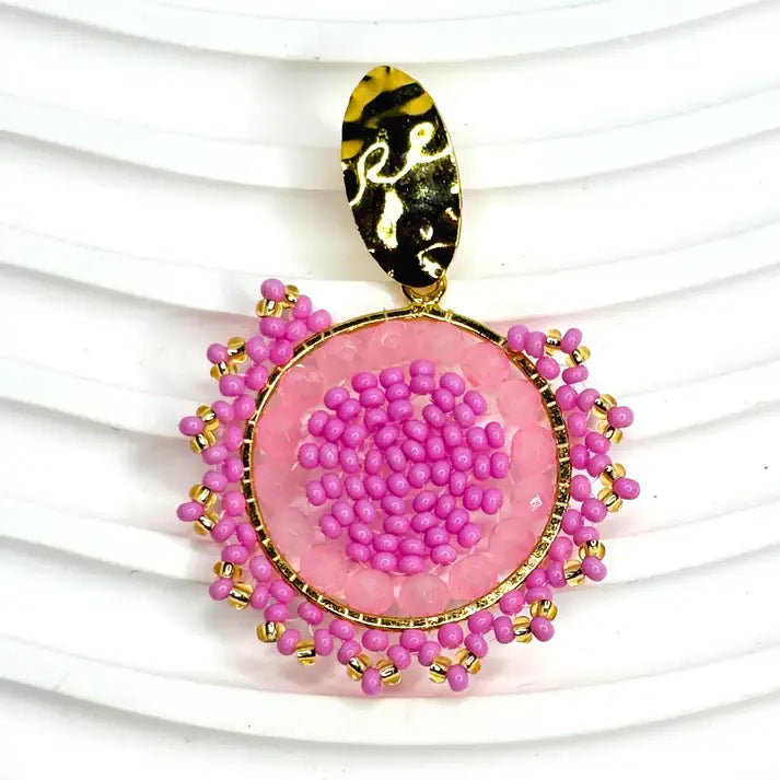 Pink Beaded Earrings with gold accents on a white background