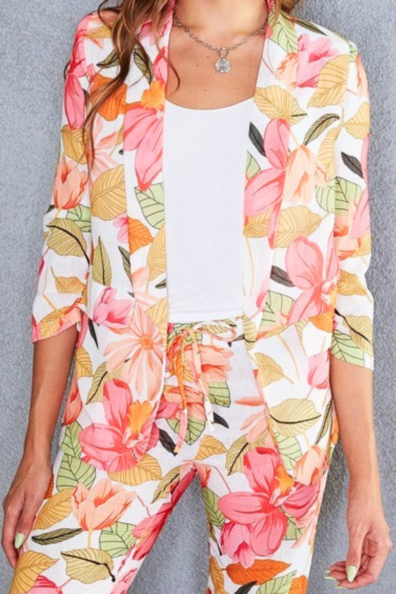 Floral patterned outfit with a white top on a gray background