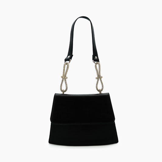 Black handbag with a unique strap design on a white background